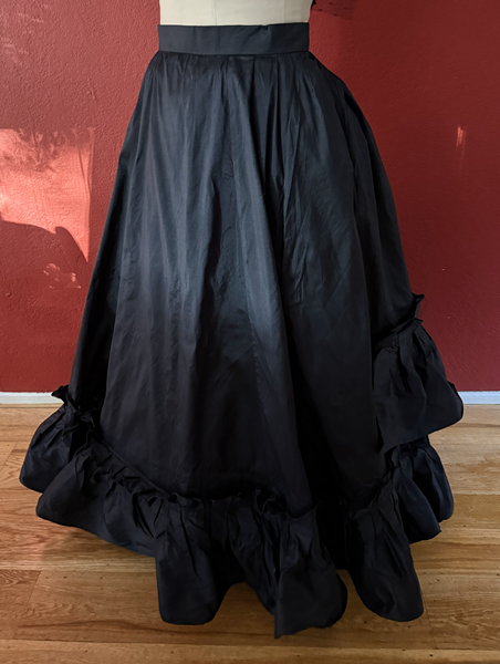 1870s Reproduction Black Watteau Silk Underskirt Left Quarter View.
