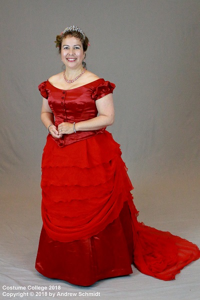 1870s Reproduction Red Bustle Dress at the at Costume College 2018. Photo by Andrew Schmidt