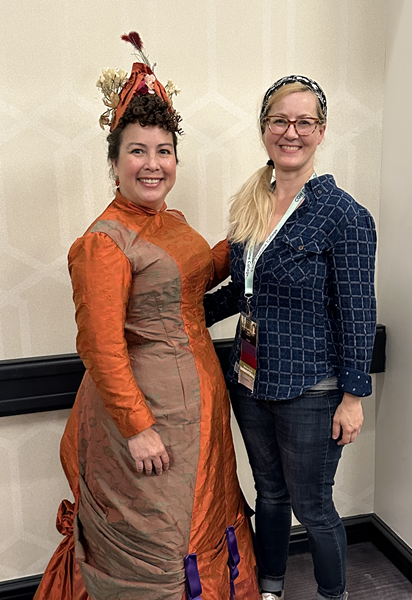 Reproduction 1878 Polonaise Natural Form Bustle - Rust Silk Day Dress. With hat designer Chantal Filson.  