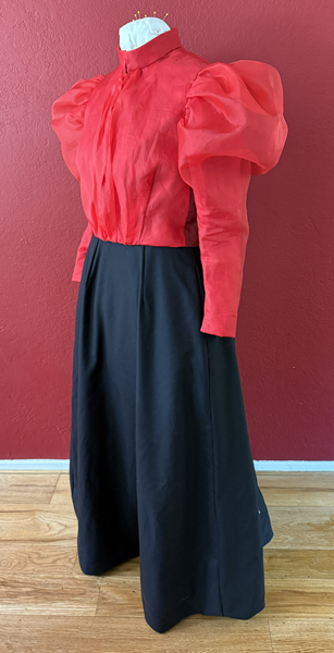 Reproduction 1890s Red Blouse and Black Skirt Left Quarter View. 