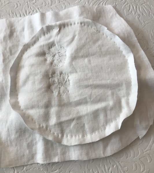 Back of quilted flowers with quilting trimmed off 