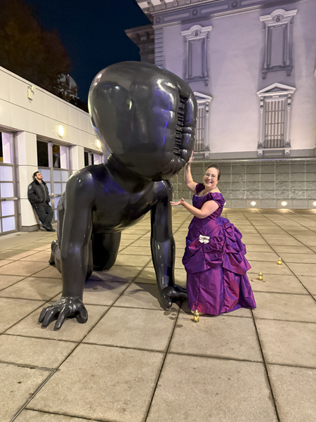 Reproduction 1880s Intergalactic Purple Evening Dress at Crocker ArtMix November 2024. With David Černý sculpture.