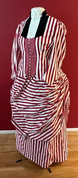 Reproduction 1885 Red Striped Seaside Dress with Plastron eft Quarter View.Truly Victorian TV