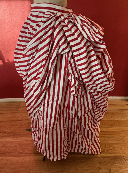 Reproduction 1887 Red Striped Overskirt Left.Truly Victorian TV367