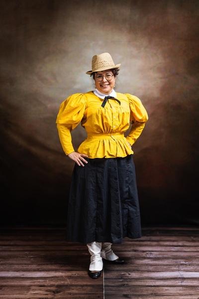 Reproduction 1890s Yellow Cycling  at  Costume College 2025. Photo by Mark Edwards Photographer. Truly Victorian TV494 Shirtwaist. Truly Victorian TV299 Split Skirt. Laughing Moon B7 Gaiters. 