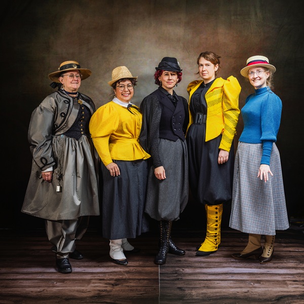 Reproduction 1890s Yellow Cycling group photo with friends  at Costume College 2025. Photo by Mark Edwards Photographer. Truly Victorian TV494 Shirtwaist. Truly Victorian TV299 Split Skirt. Laughing Moon B7 Gaiters. 